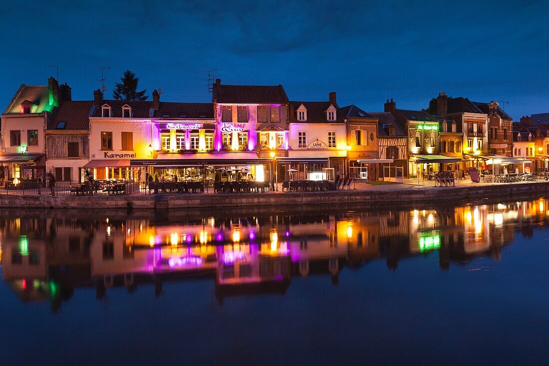 France, Picardy Region, Somme Department, Amiens, Quartier St-Leu, restaurants along the Somme River, dusk