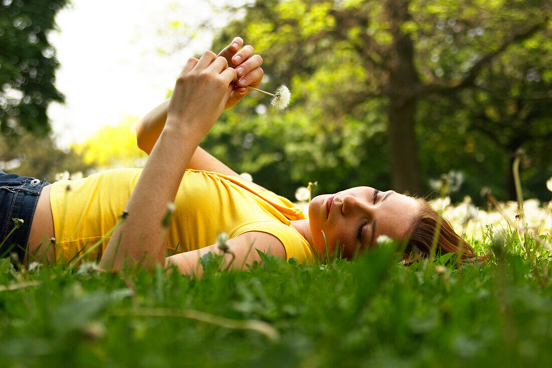 Young Woman Lying in Grass