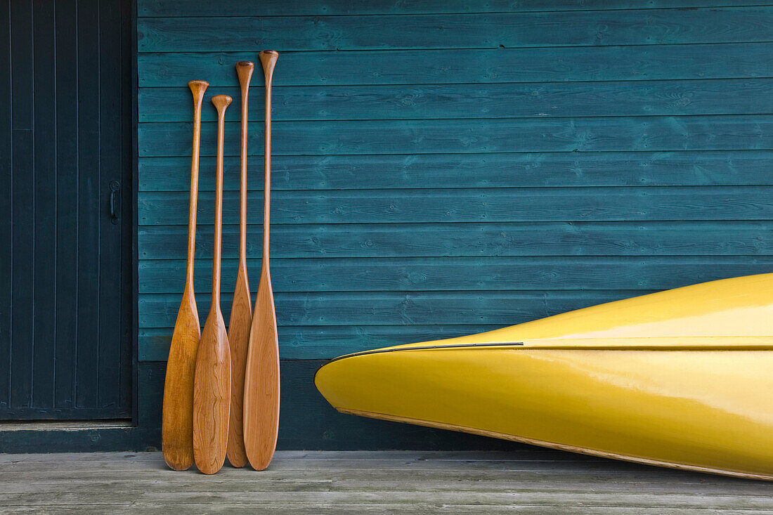 Yellow canoe and paddles on dock, Algonquin Park, Ontario