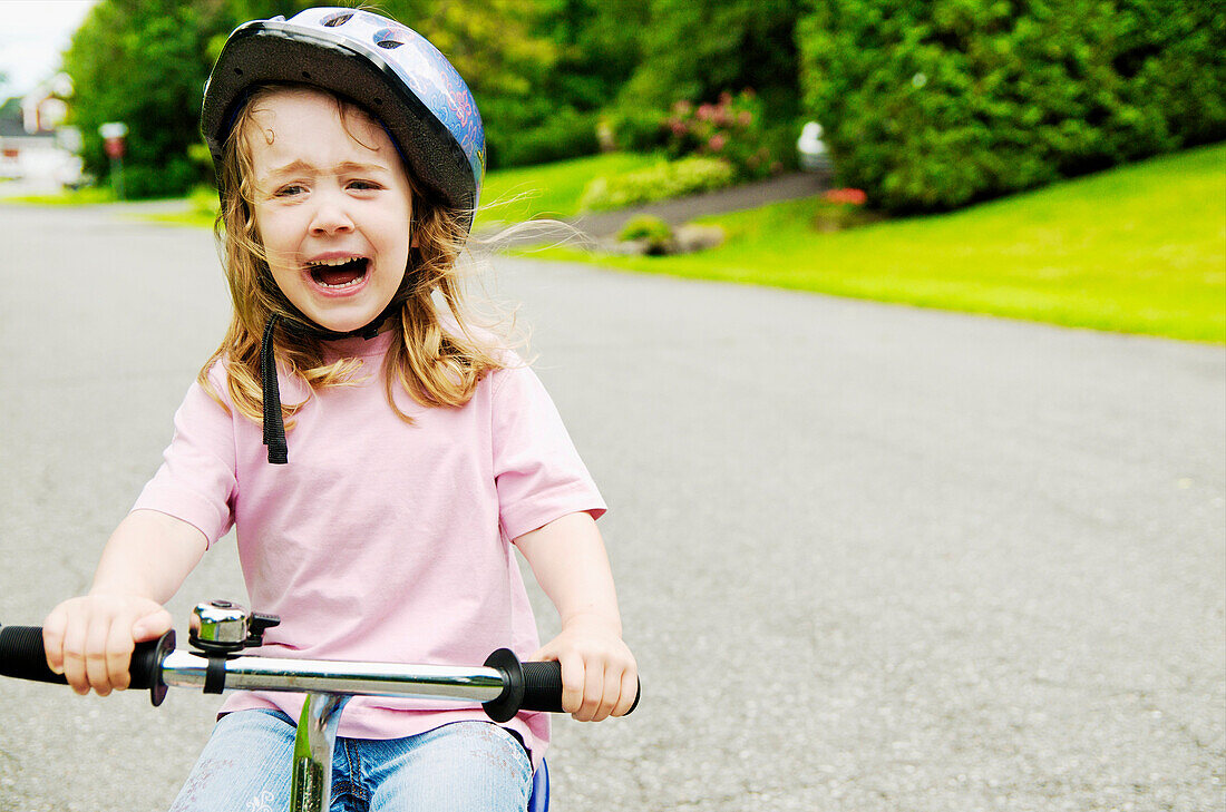 Girl riding bike and crying, Otterburn Park, Quebec