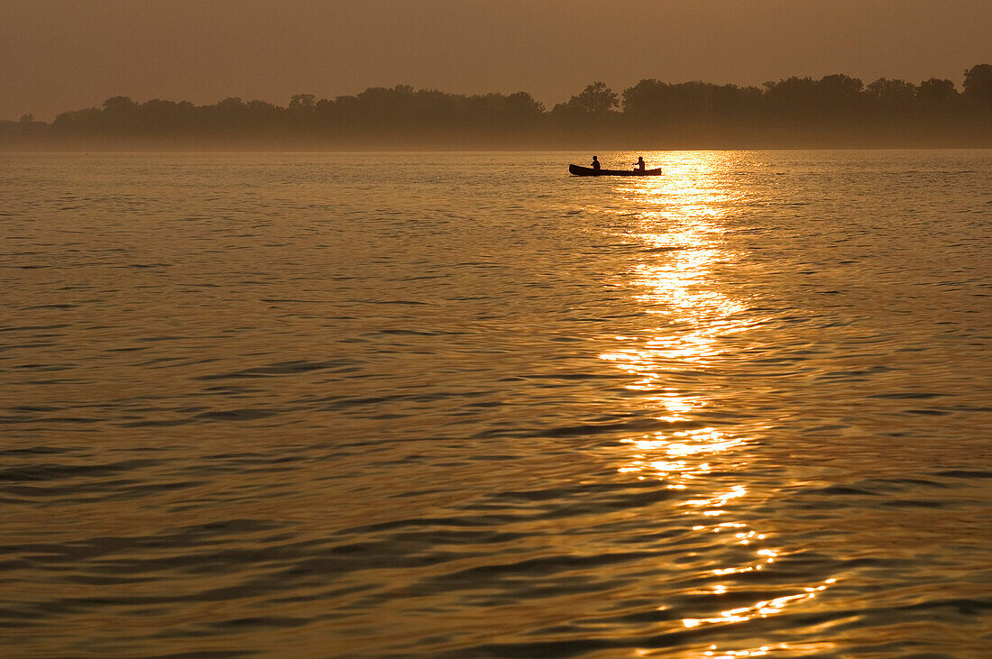 Two people in a canoe at Sunset, Toronto, Ontario