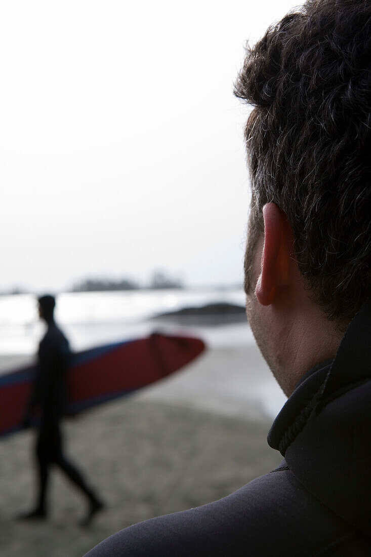 Man Watches a Surfer and the Ocean, Tofino, British Columbia