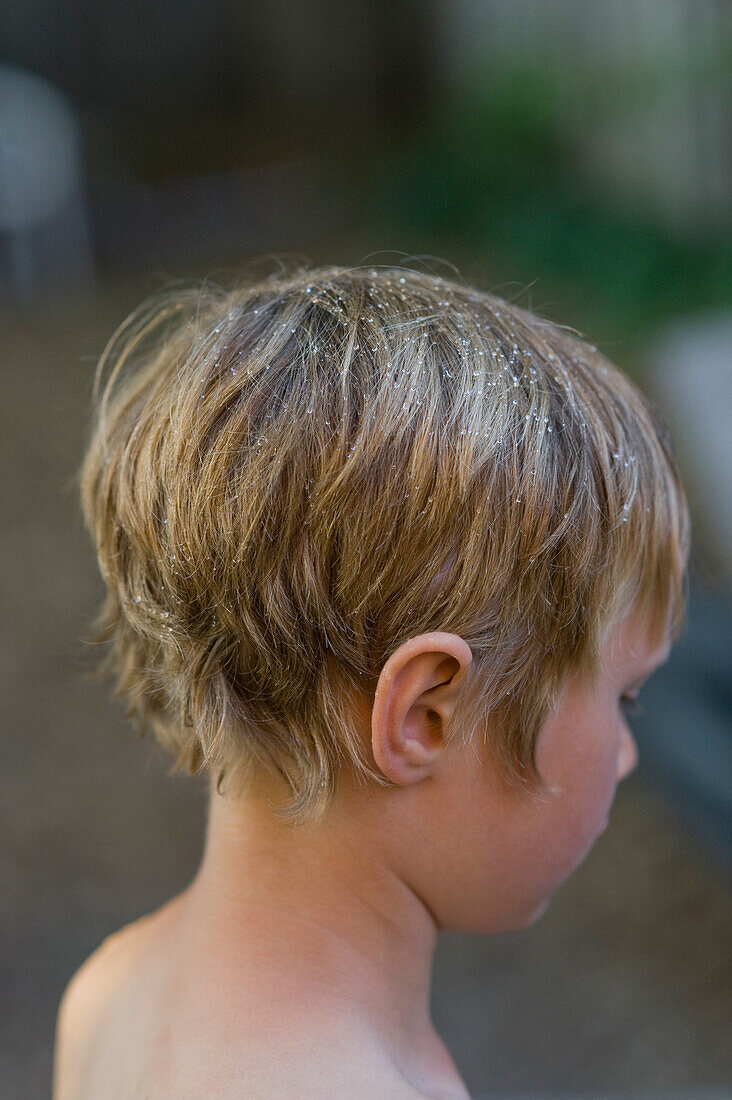 Young Boy with drops of water on his hair