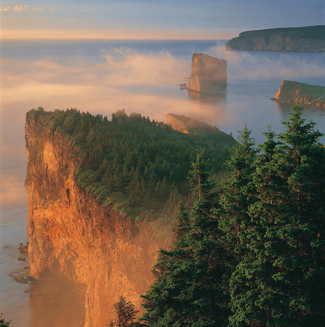 Perce Rock and the Three Sisters in Fog at Sunrise, Gaspe Peninsula, Quebec