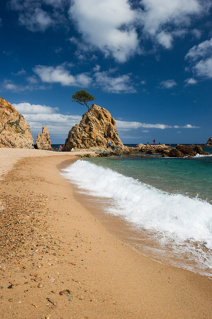 Red sand beach and rocky coast, Tossa de Mar, Costa Brava, Spain