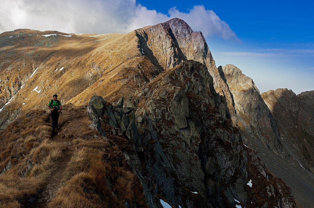 Hiker on the way to Cabana Podragu, Fagaras Mountains, Transylvania, Romania