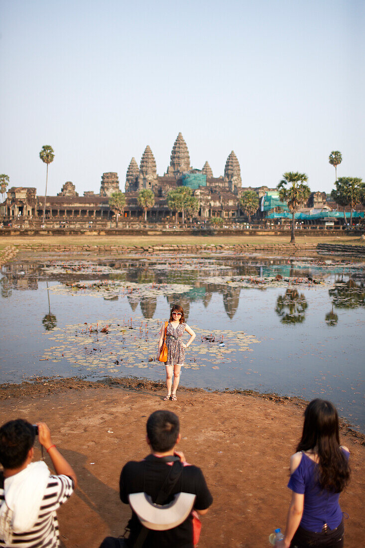 Tourists taking pictures in the morning, Angkor Wat Temple, Angkor Archaeological Park, Siem Reap, Cambodia