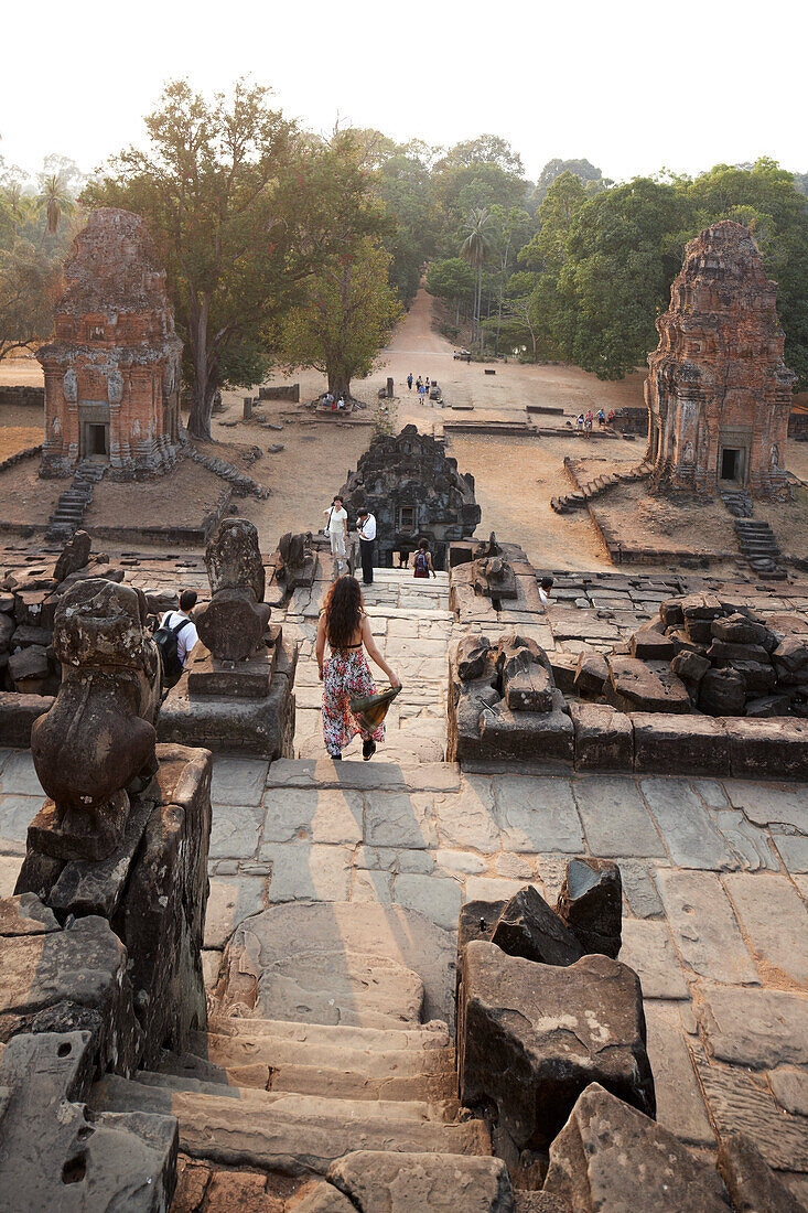 Visitors at the Bakong Temple mountain in the evening, Roluos, Siem Reap, Cambodia