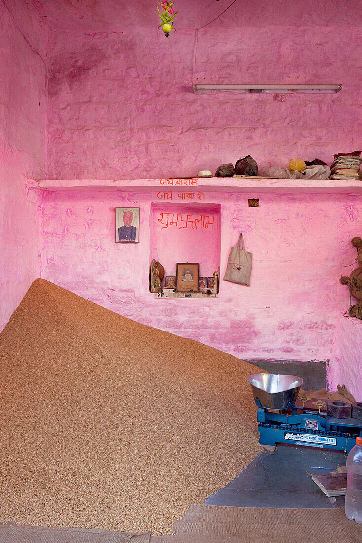 Shop selling grain with home altar, Jodhpur, Rajasthan, India