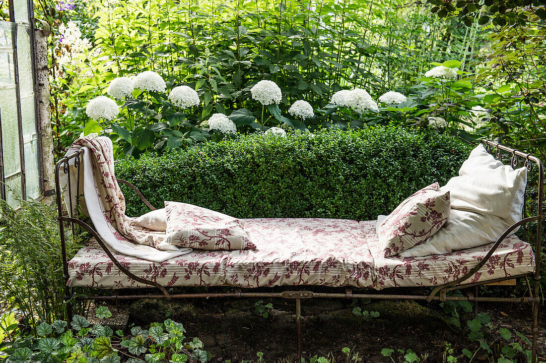 Garden still life with antique bed and summer flowers, Freiamt, Emmendingen, Baden-Wuerttemberg, Germany