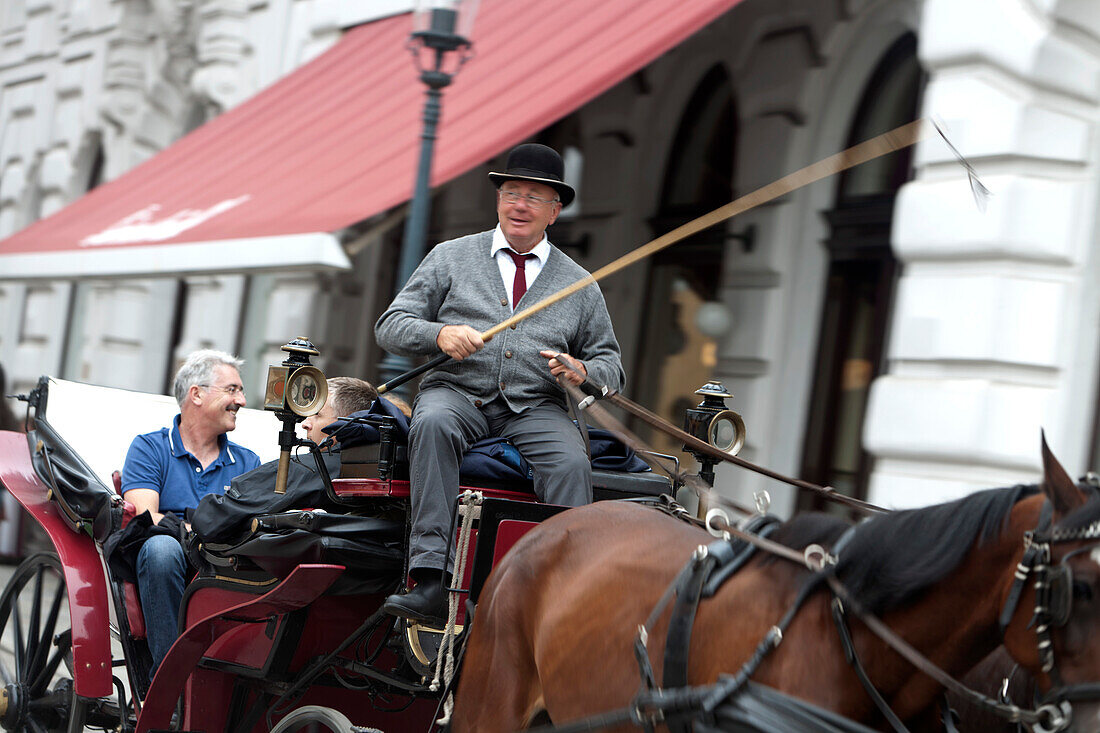 Fiaker and horse-drawn carriage on Michaelerplatz, Vienna, Austria