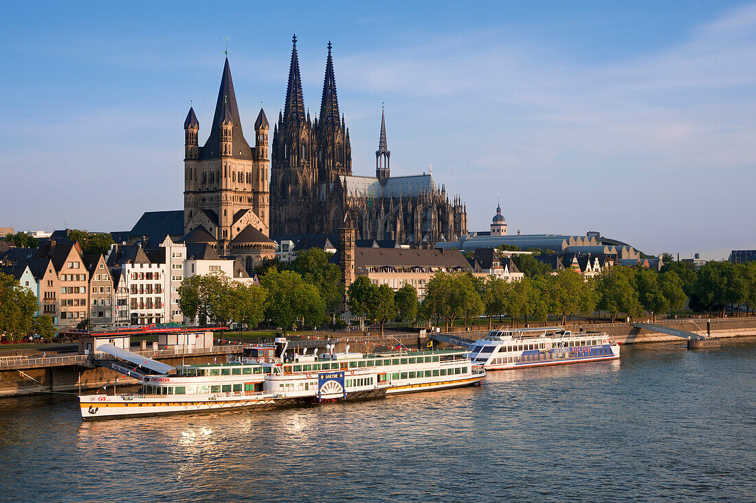 Paddle steamer Goethe on the Rhine river in front of Cologne cathedral and Gross-Sankt-Martin church, Cologne, Rhine river, North Rhine-Westphalia, Germany