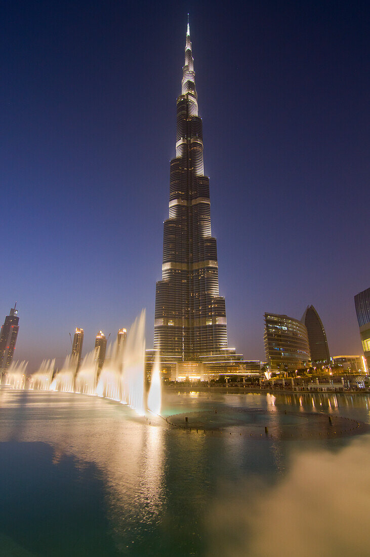 Burj Khalifa With Fountain At Dusk In Dubai, Uae