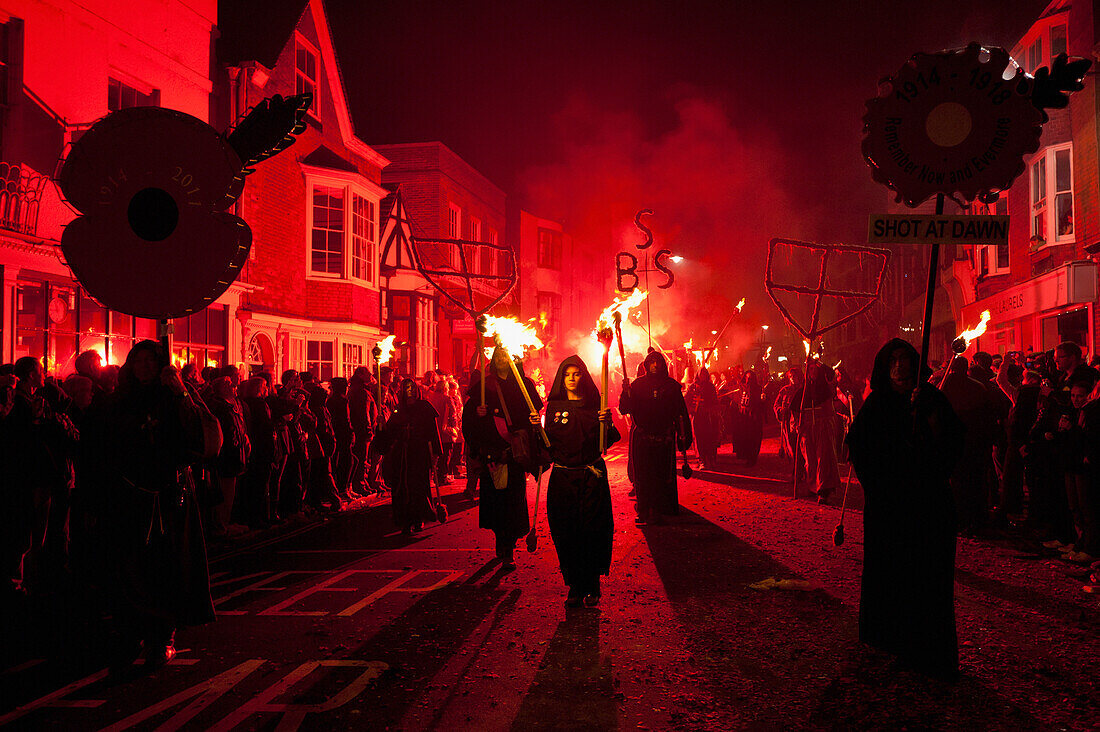 People Dressed As Monks From Southover Bonfire Society Marching On The United Grand Procession In Lewes On Bonfire Night, East Sussex, Uk