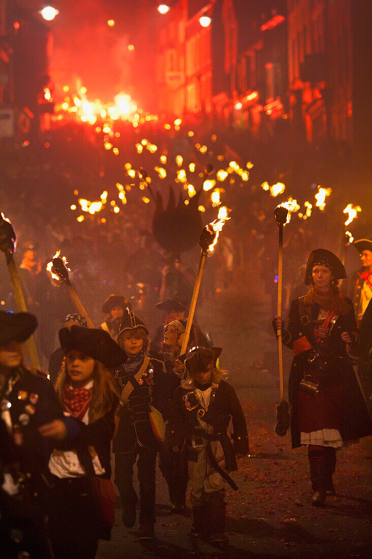 Lady With Children Dressed As Pirates Marching On The United Grand Procession On Bonfire Night Through The Streets Of Lewes, East Sussex, Uk