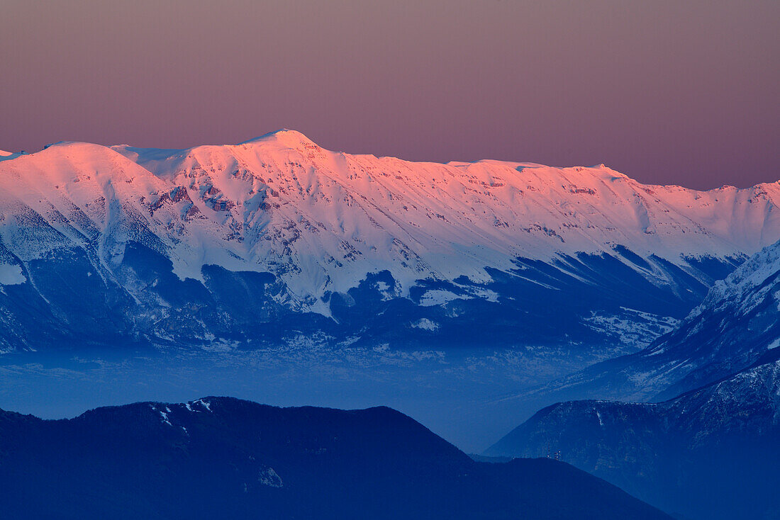 Snow-covered group of Majella with Monte Pesco Falcone and Monte Amaro in alpenglow, Abruzzi, Apennines, l' Aquila, Italy