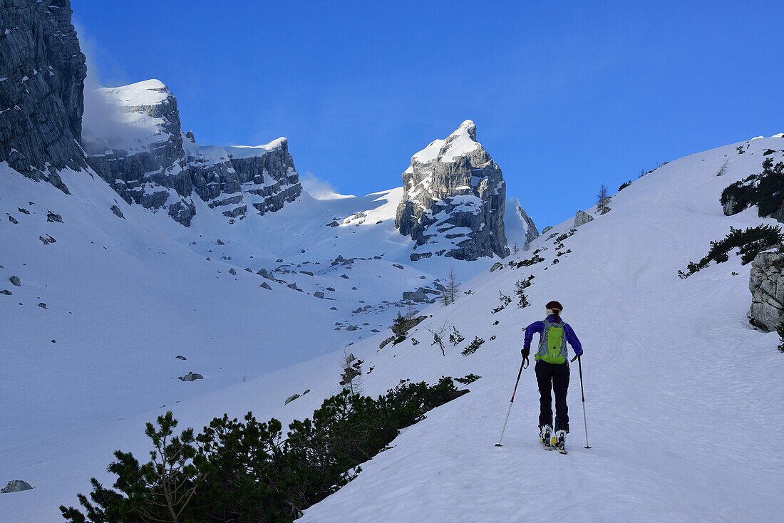 Female backcountry skier ascending to Watzmannkind, Watzmannkar, Berchtesgaden Alps, Berchtesgaden National Park, Upper Bavaria, Bavaria, Germany