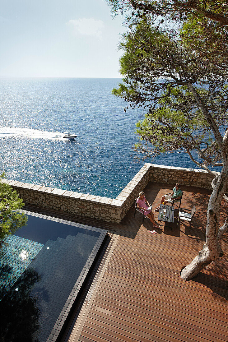 Guests on deck near the Cliff Pool, Aman Sveti Stefan, Sveti Stefan, Budva, Montenegro