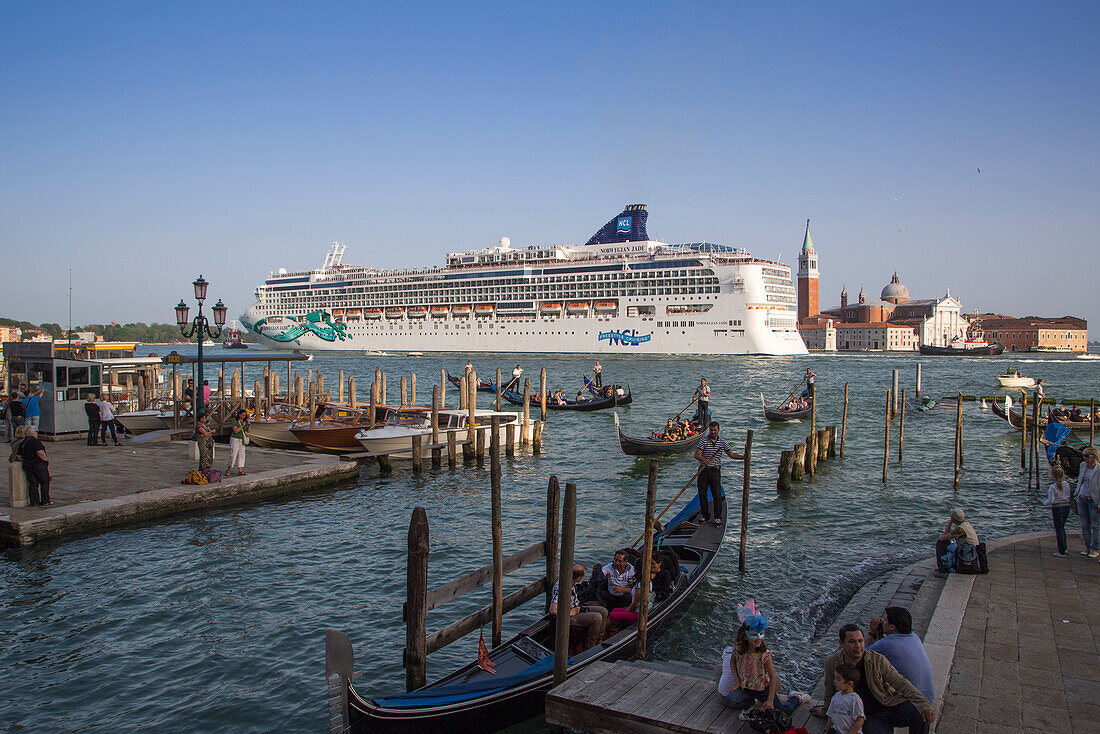 Gondolas and cruise ship Norwegian Jade (Norwegian Cruise Line) in Bacino di San Marco with Isola di San Maggiore island in distance, Venice, Veneto, Italy, Europe