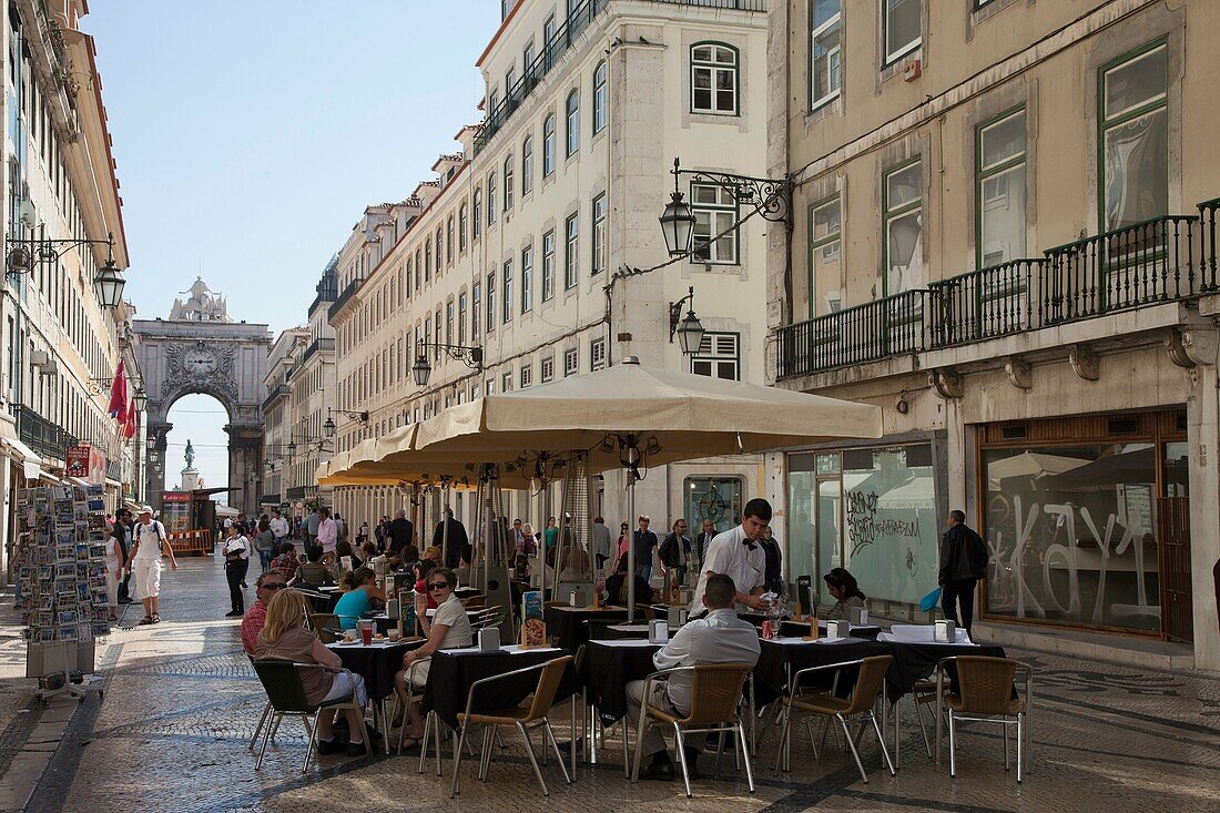 Portugal Lisbon. Rua Augusta. People in outdoor restaurant.