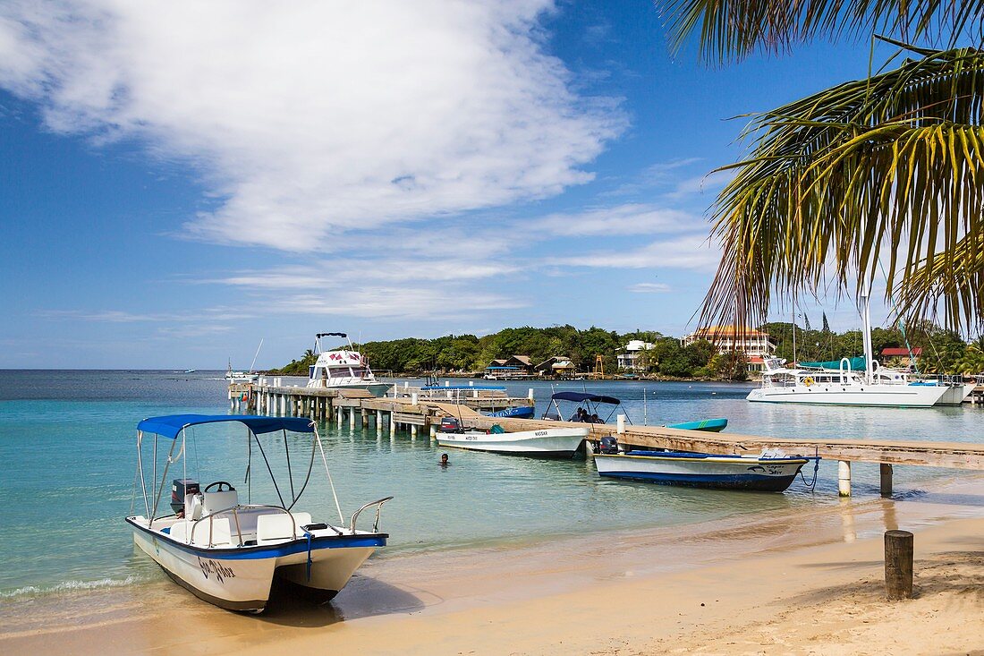 The beach, pier, restaurants and boats at West End in Roatan, Honduras