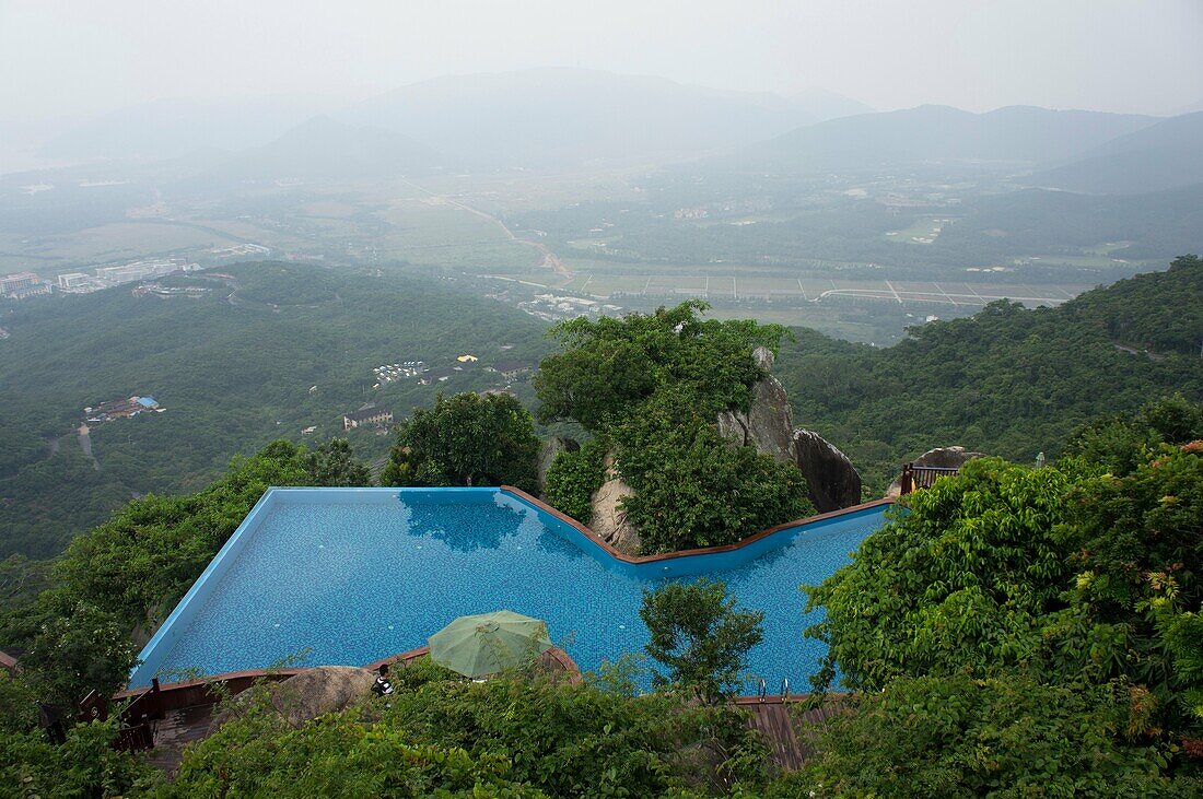 Swimming pool on hilltop at Yalong Bay Tropical Paradise Forest Park, Hainan Island, China.