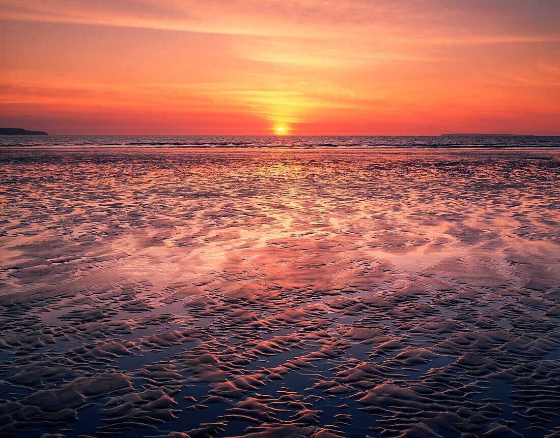 Sunset at Westward Ho! beach, North Devon, England.