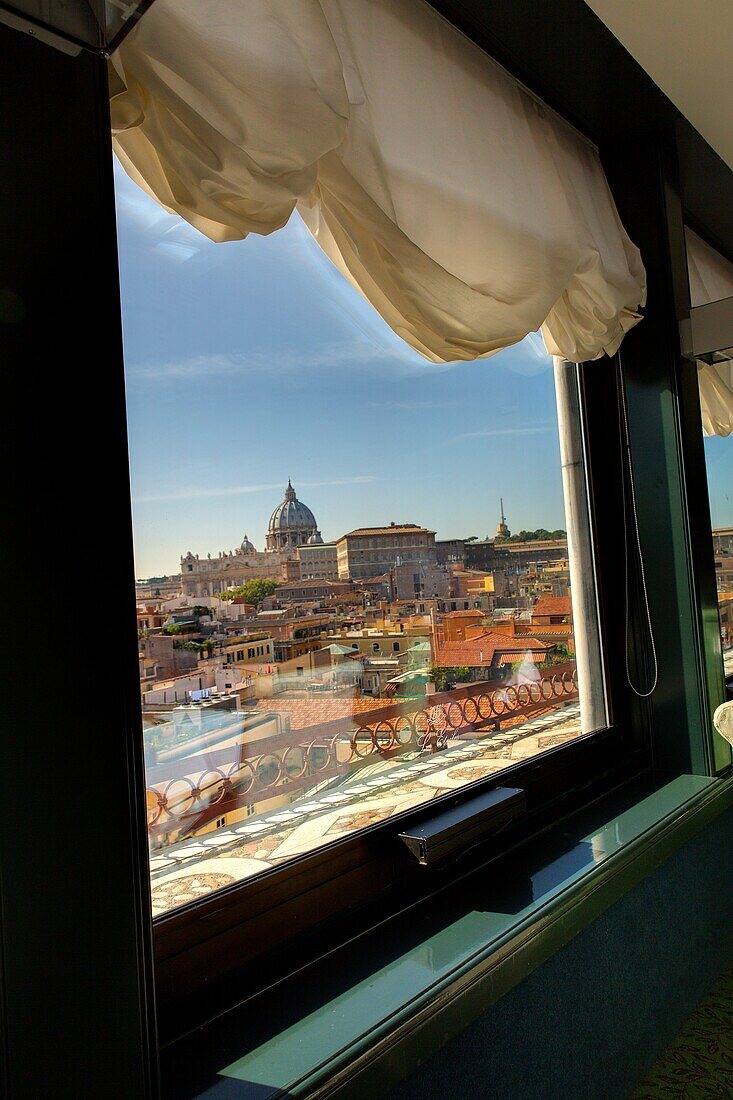 Window view Saint Peter´s cathedral dome in the distance Rome Italy