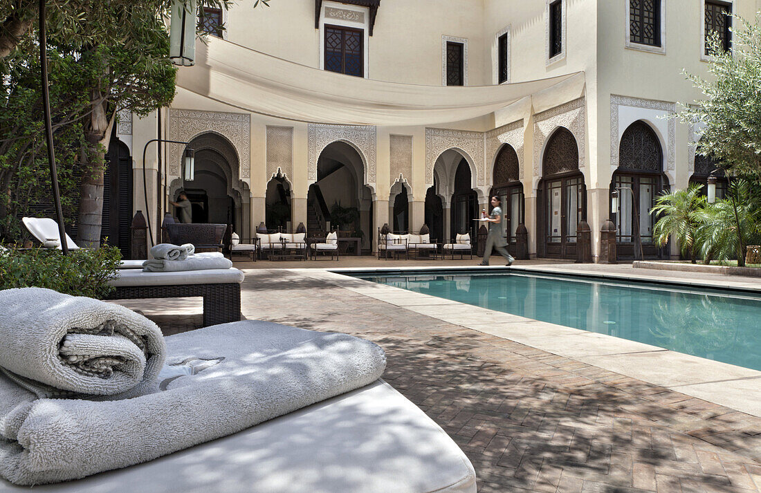 Loungers around the swimming pool, Villa des Orangers, Marrakech, Morocco