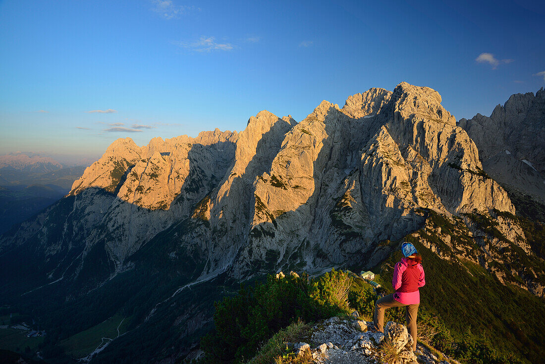 Woman looking mountain scenery from Stripsenkopf, Zahmer Kaiser, Kaiser mountain range, Tyrol, Austria