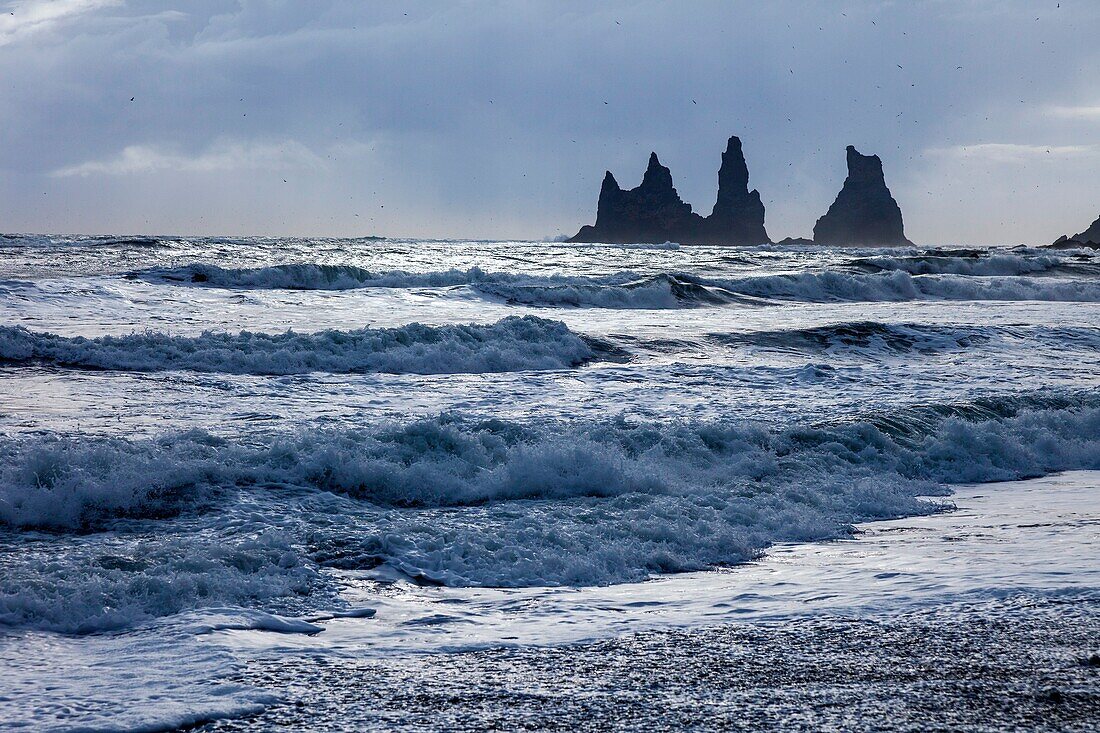 Rock formations and sea surf at Dyrholaey, ISouthern Iceland, Iceland, Europe.