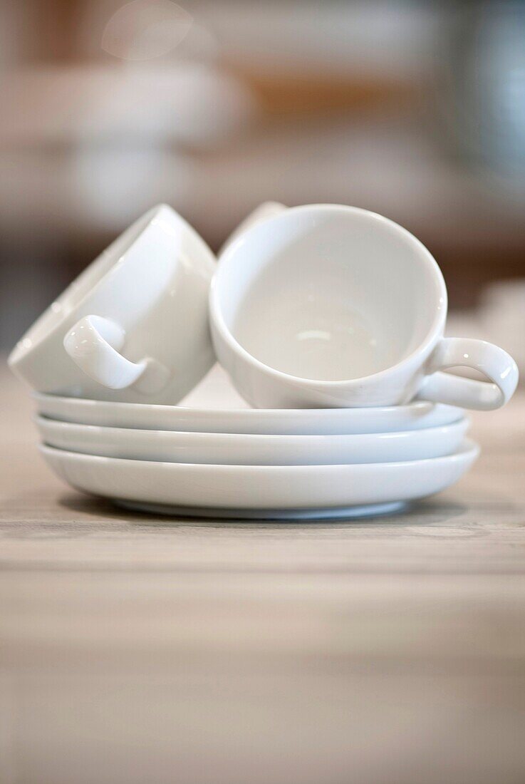 white porcelain tea cups and saucers