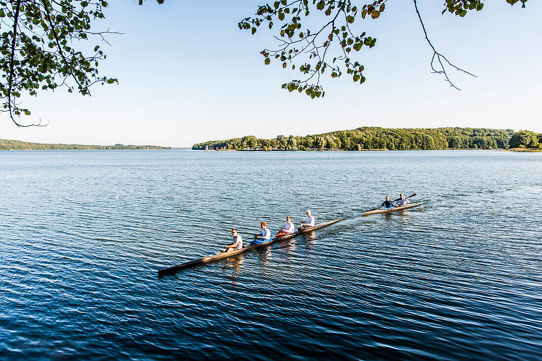 Kayakers on lake Ratzeburg with the cathedral of Ratzeburg in the background, Ratzeburg, Schleswig-Holstein, north Germany, Germany