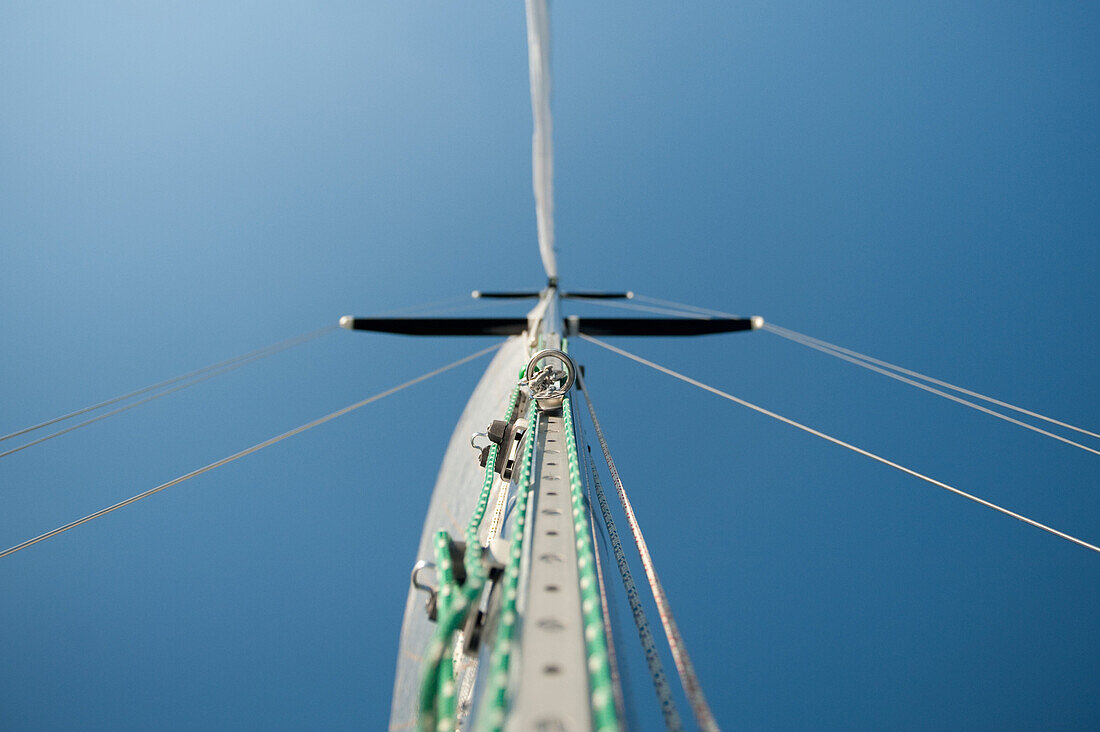 Sailboat Mast and Halyards Against Blue Sky, Low Angle View