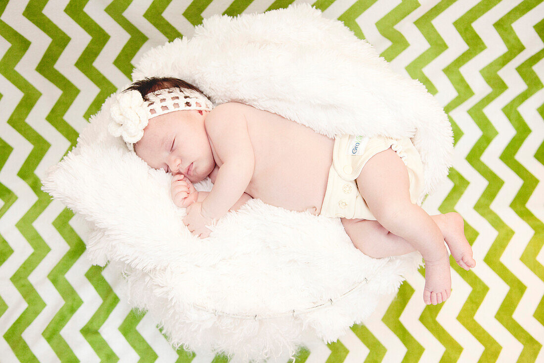 Sleeping Newborn Baby on Green Chevron Background