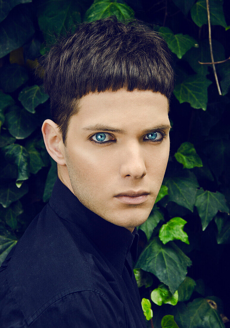 Serious Young Man with Bangs and Blue Eyes