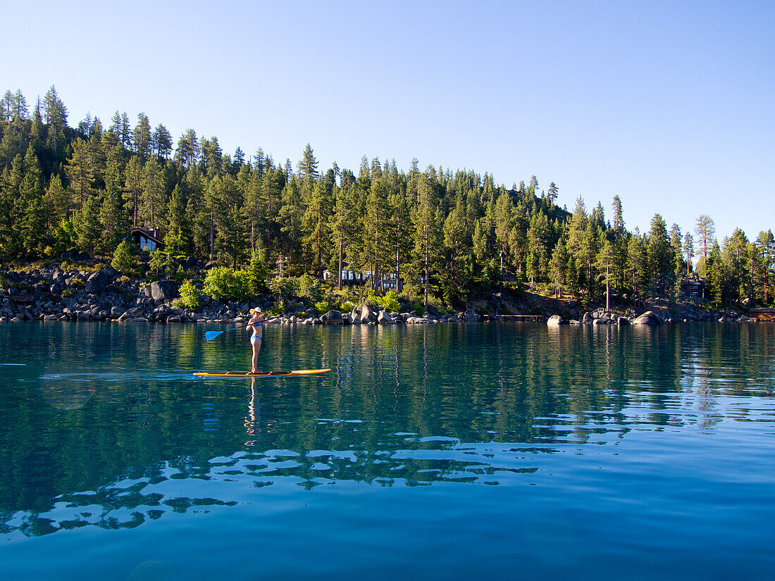 Woman Paddling on Lake