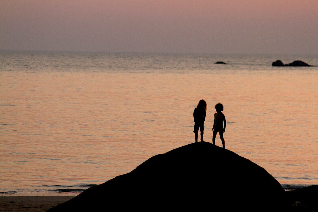 Girl and Boy on Rock by Sea, Silhouette