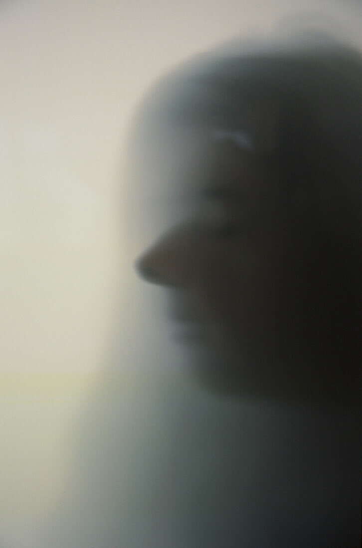 Woman's Face Behind Frosted Glass