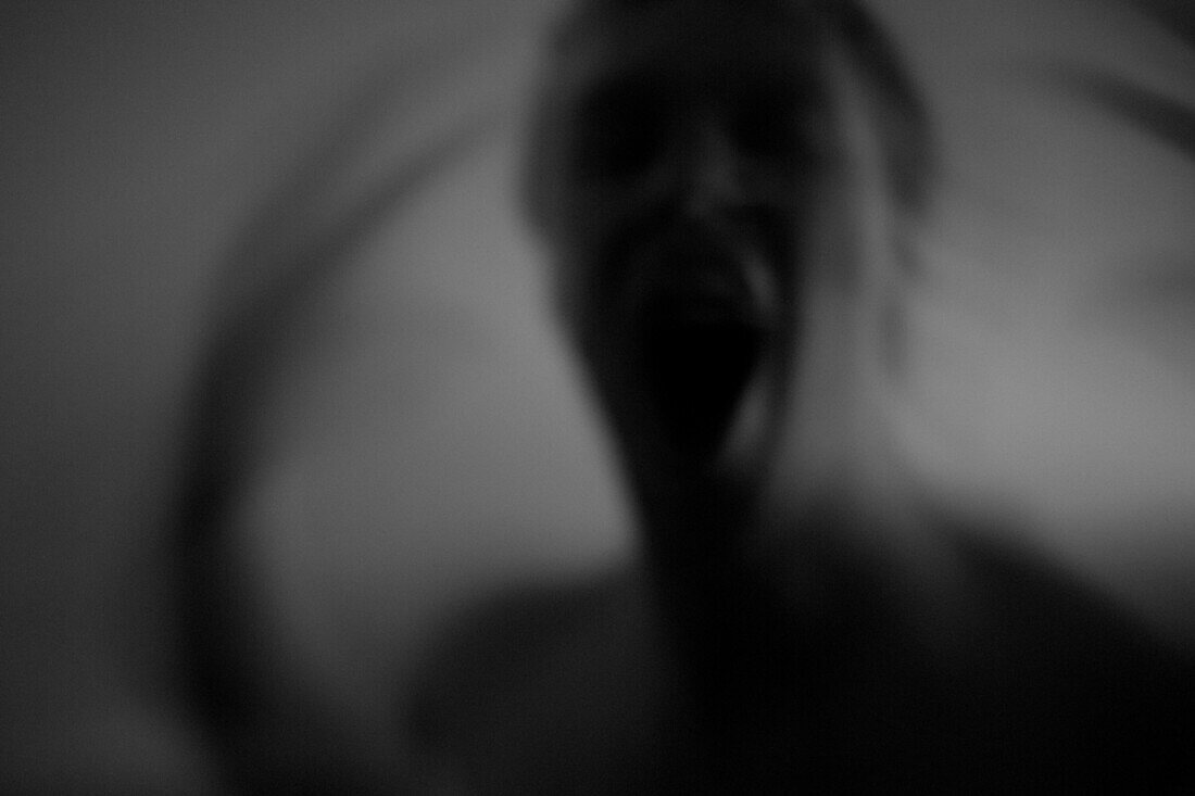 Blurred Screaming Young Man