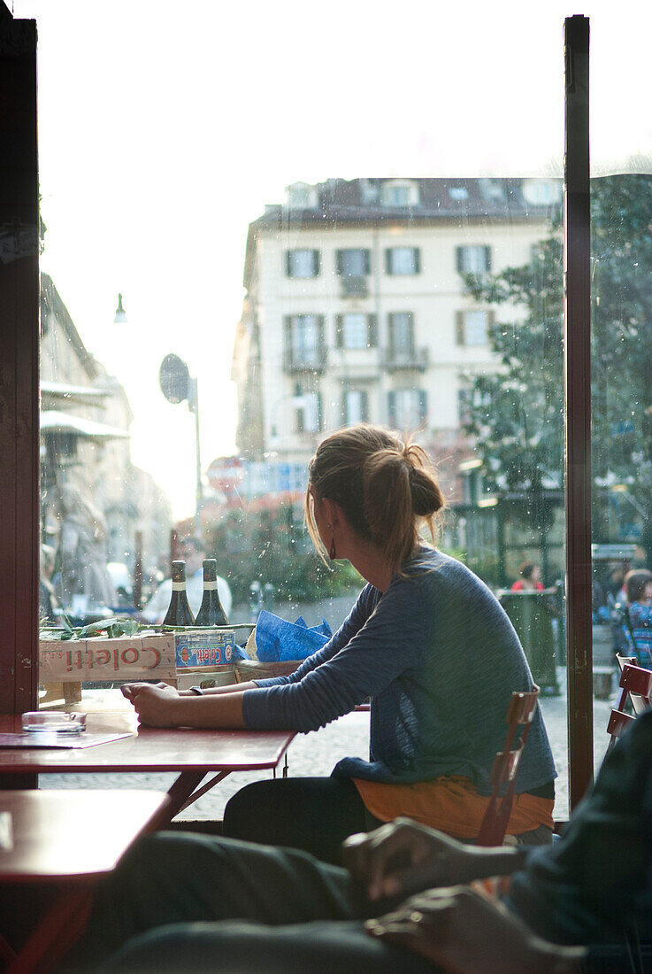 Woman Sitting at Café Table, Italy