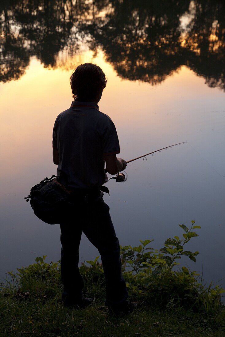 Black Bass Fisherman At Dawn, No-Kill Fishing With The Fish Being Immediately Returned To The Water, Douy Lake Near Chateaudun, Eure-Et-Loir (28), France