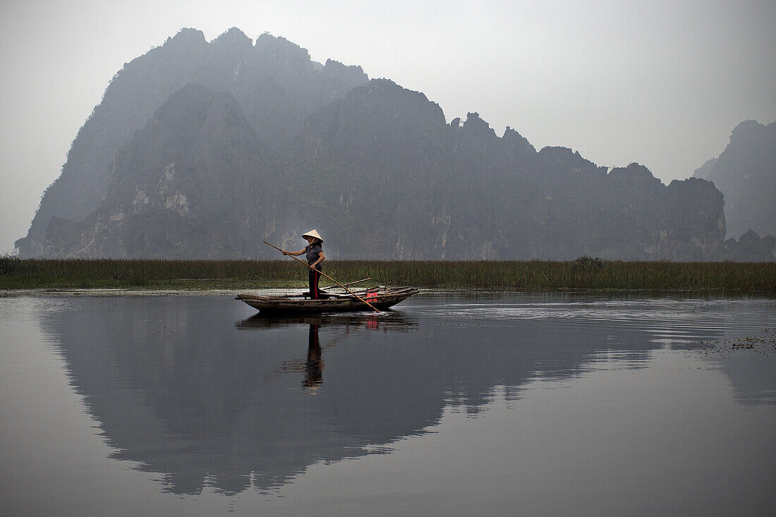 Small Boat In The Terrestrial Ha Long Bay, Tam Coc, Near Ninh Binh, Vietnam, Asia