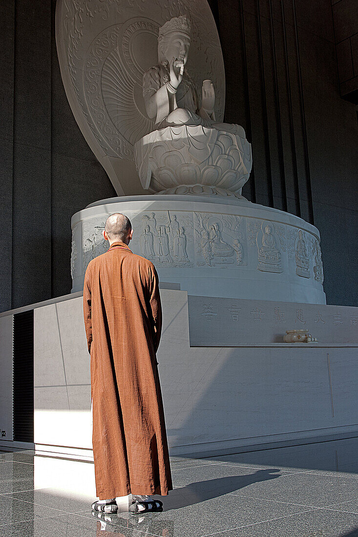 Monk Praying In The Buddhist Monastery Of Chung Tai Chan, Taiwan