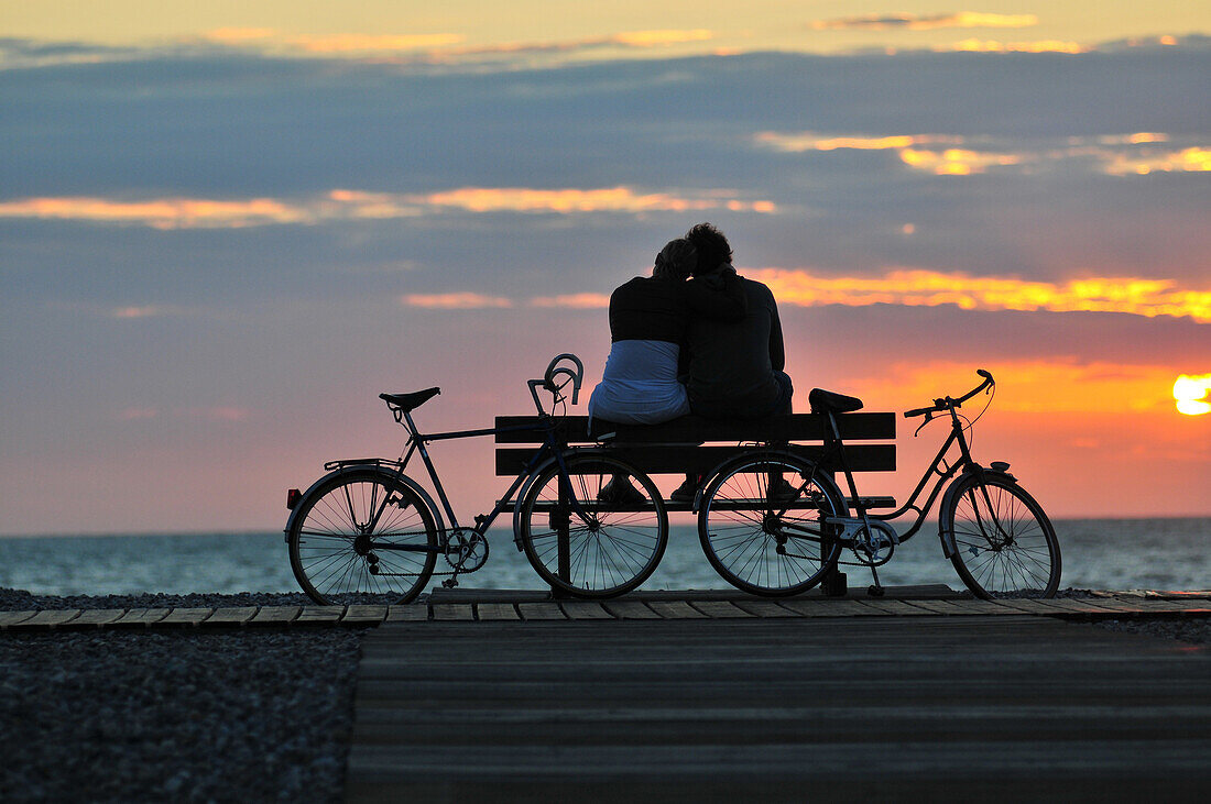 Couple Sitting On A Bench At Sunset, Cayeux-Sur-Mer, Bay Of Somme, Somme (80), France