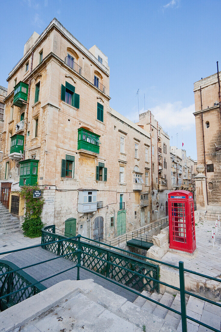Red Telephone Booth And Buildings With Enclosed Balconies, Valletta, Malta