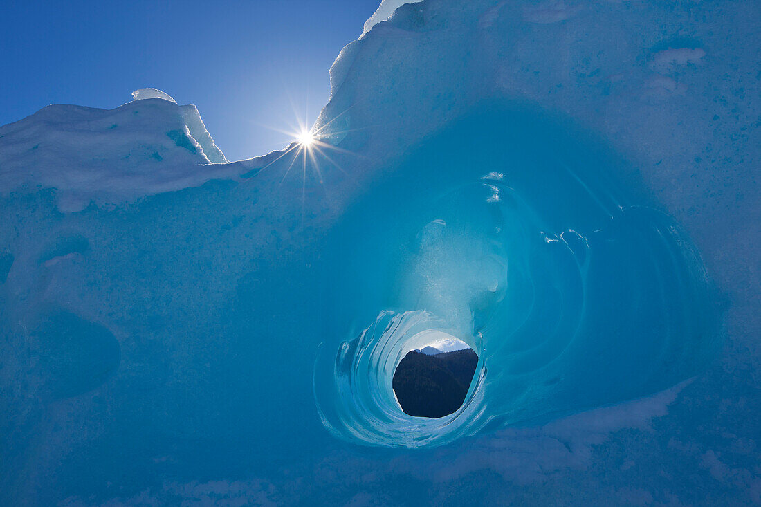 Small Tunnel Eroded In An Iceberg Frozen In Mendenhall Lake, Juneau, Southeast Alaska, Winter