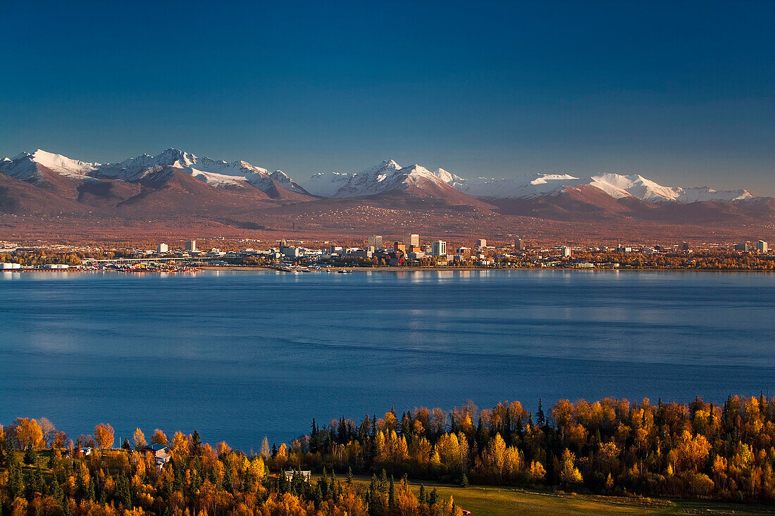 Aerial View Of Anchorage, Looking To The South With The Chugach Mountain Range In The Background, During Autumn In Southcentral, Alaska