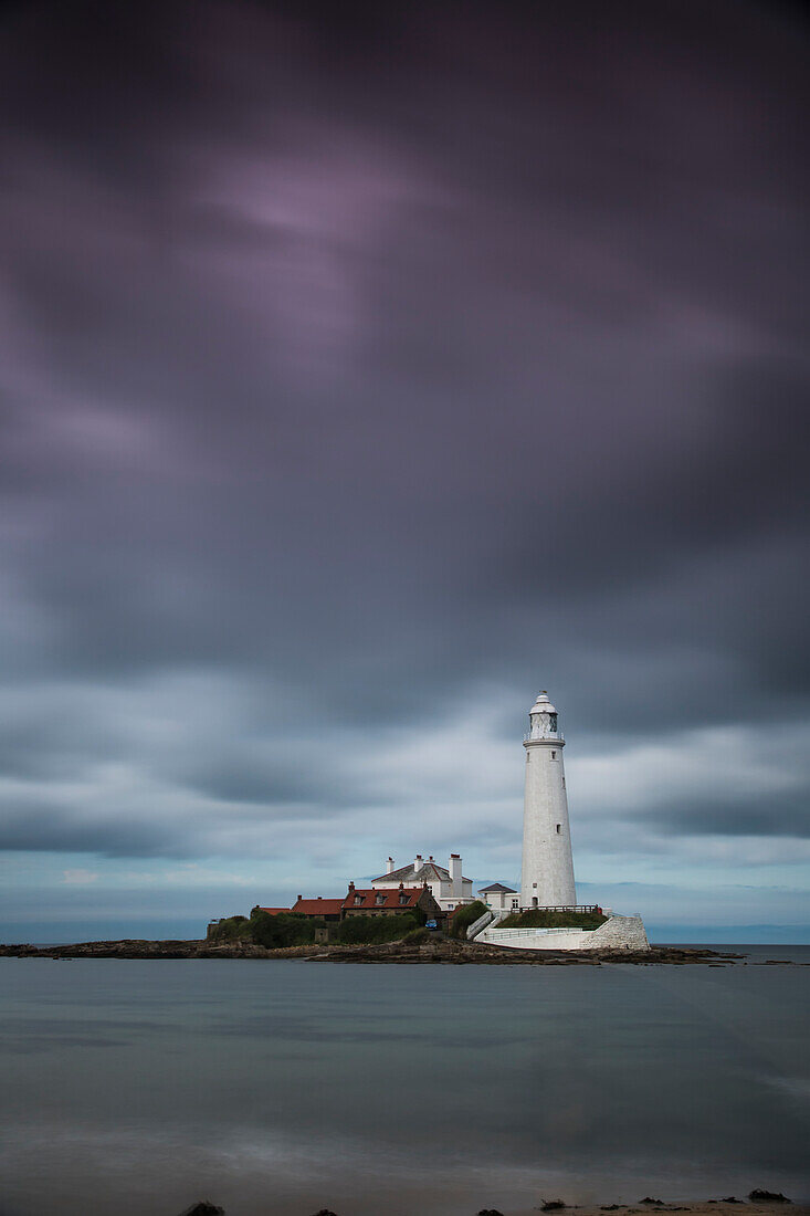 'A White Lighthouse Under Storm Clouds; St. Mary's Island Northumberland England'