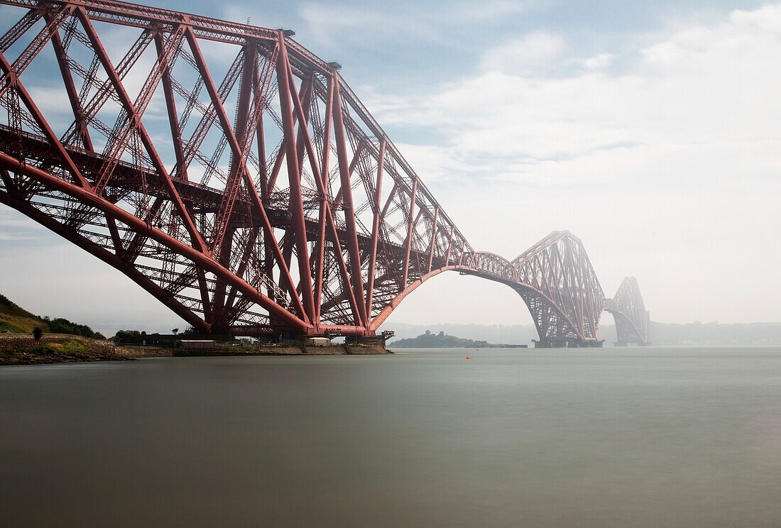 'Forth Bridge Going Over The Water In The Fog; North Queensferry Scotland'